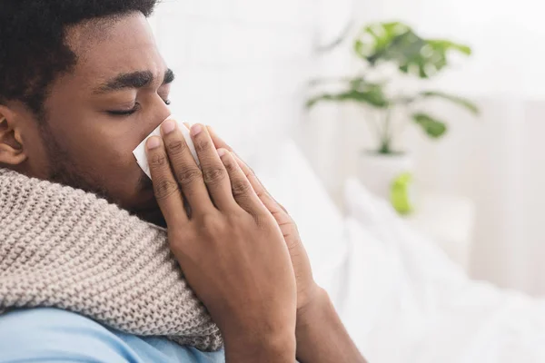 African-american man man has runny nose at home — Stock Photo, Image