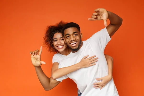 Couple having fun taking picture with imaginary camera — Stock Photo, Image