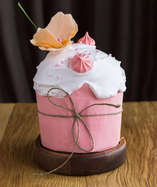 Traditional Easter sweet cake decorated with pink meringue