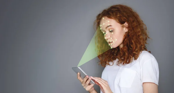 Woman with smartphone using face ID recognition system