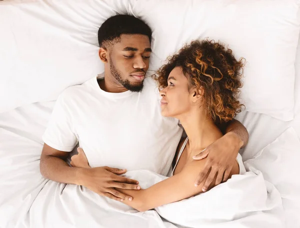 Happy couple flirting in morning on comfortable bed — Stock Photo, Image