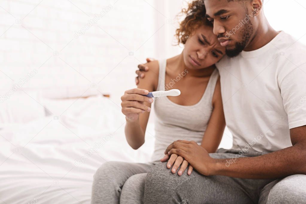 Black couple with a negative pregnancy test result