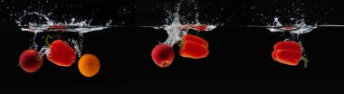 Siyah taze elma, portakal ve biber su sıçrama