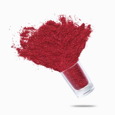 Glass jar with sumac flying on white background clipart