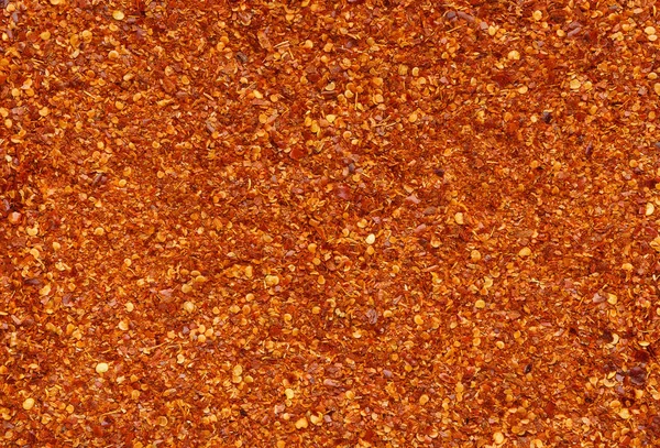 Textura de chile picante rojo seco triturado —  Fotos de Stock