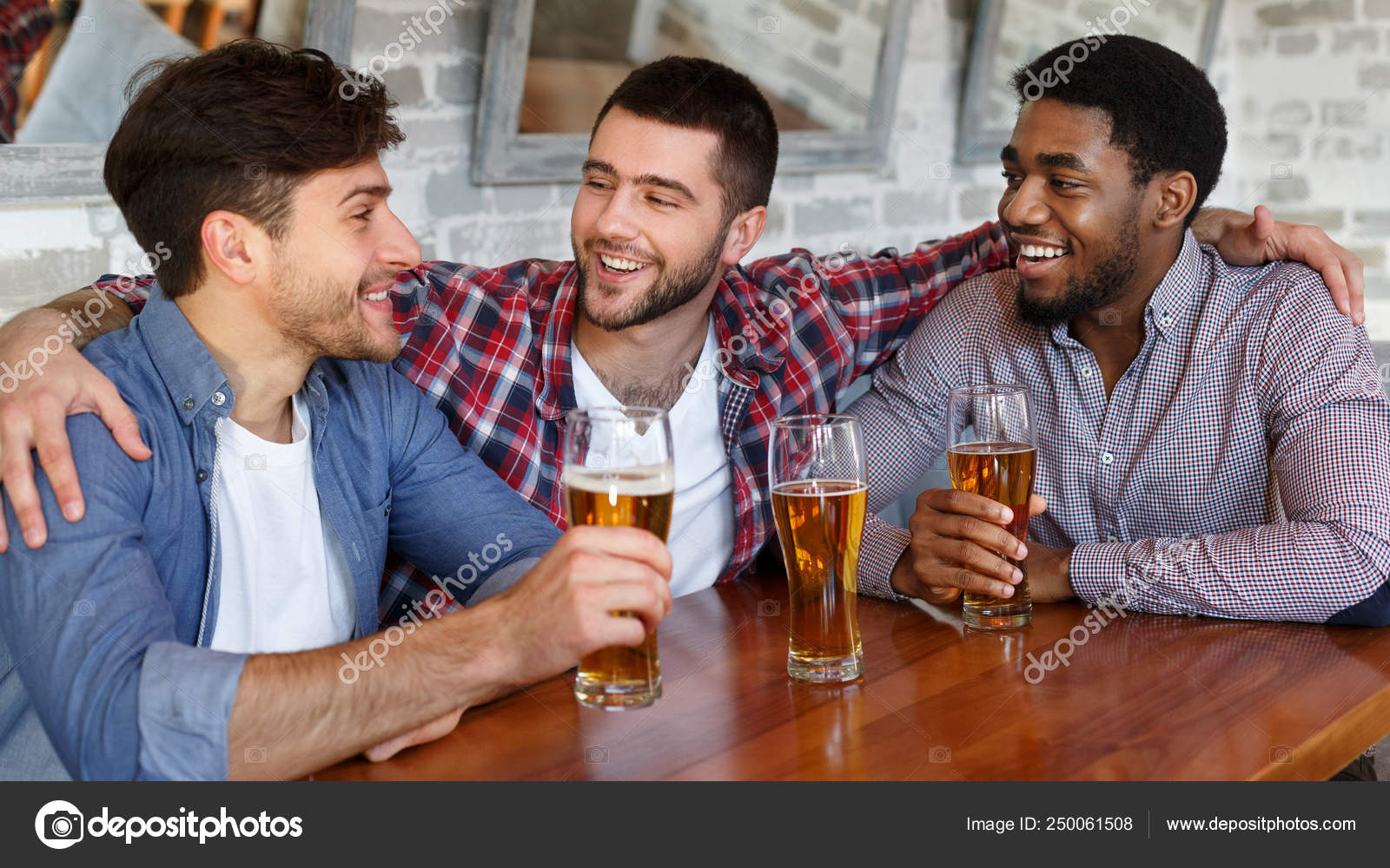 Friends hanging out and communicating in bar — Stock Photo © Milkos  #250061508, image size:1600x1000