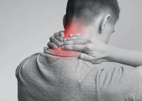 Strong man with neck pain, back view — Stock Image Strong man with neck pain, back view Royalty Free Stock Images