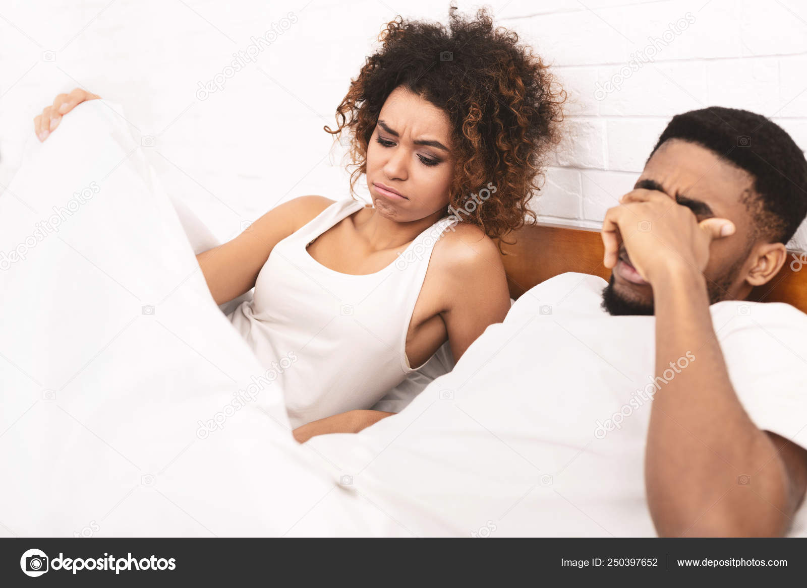 Woman In Bed Looking Under Blanket Man With Erectile Dysfunction Stock Photo Image By C Milkos 250397652