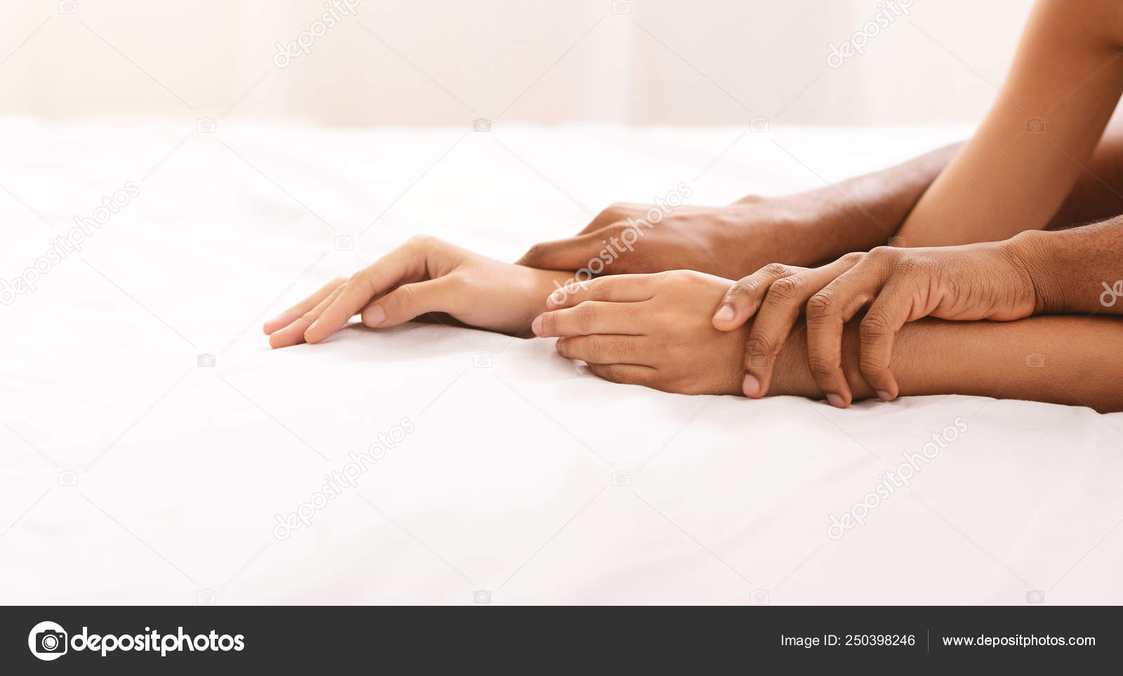 Black man and woman hands having sex on bed Stock Photo by ©Milkos 250398246