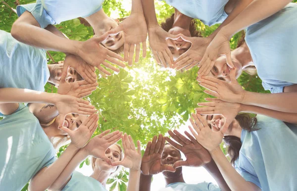 Creative team putting their hands together in circle — Stock Photo, Image