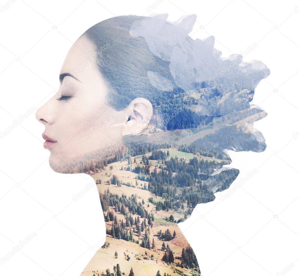 Double exposure of female face and rocky landscape