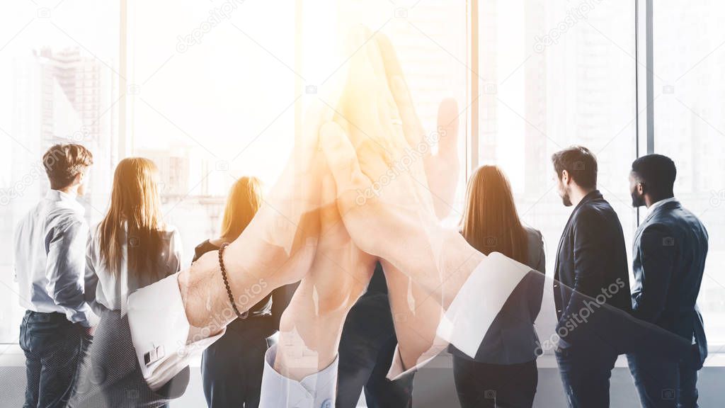 Multi exposure of business team high five with group of colleagues