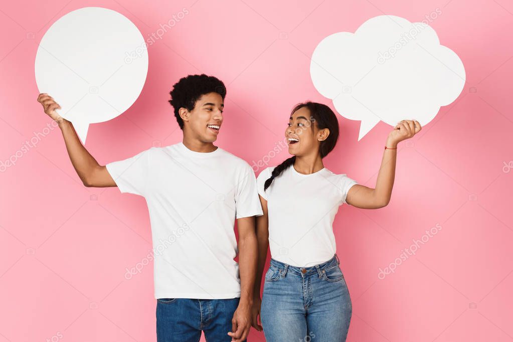 Teen couple with speech bubbles on pink background