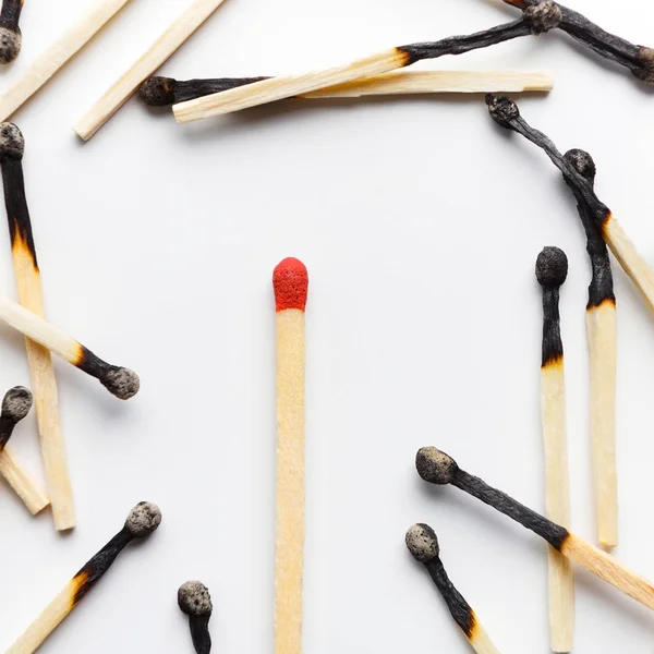 Group of burnt matches with one unused matchstick — Stock Photo, Image