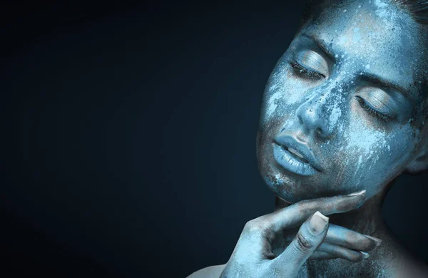 Beauty portrait of young woman with blue artistic makeup Royalty Free Stock Photos