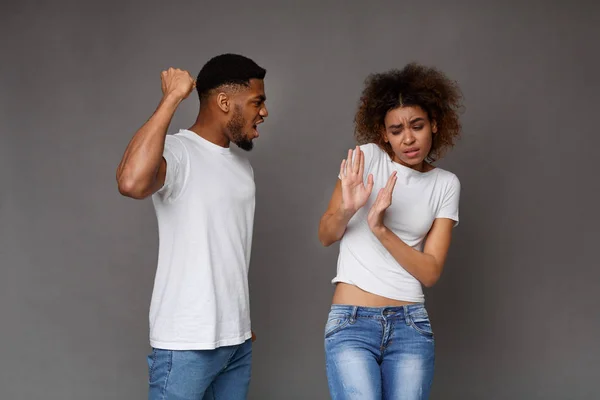 African-american man beating his wife, domestic violence — Stock Photo, Image