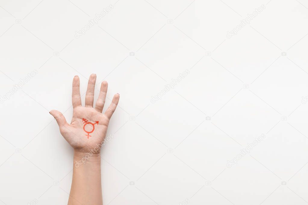 Transgender symbol painted on palm, copy space