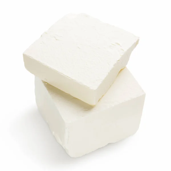 Morceaux de fromage Feta sur blanc — Photo