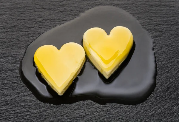 Melting butter hearts — Stock Photo, Image