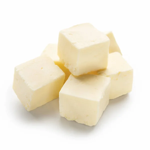 Cubos de manteiga sobre branco — Fotografia de Stock