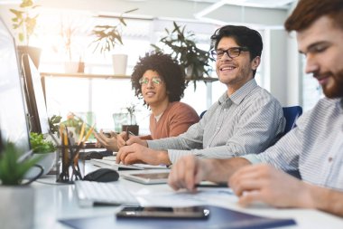 Young male team working at IT developing company