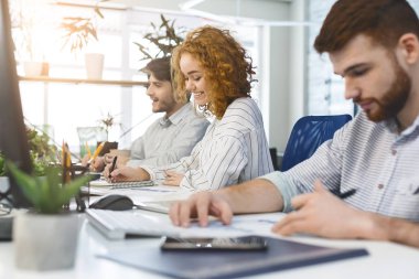Young woman journalist working in public coworking space