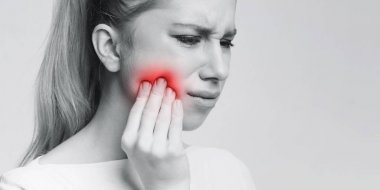 Woman suffering from strong tooth pain, panorama