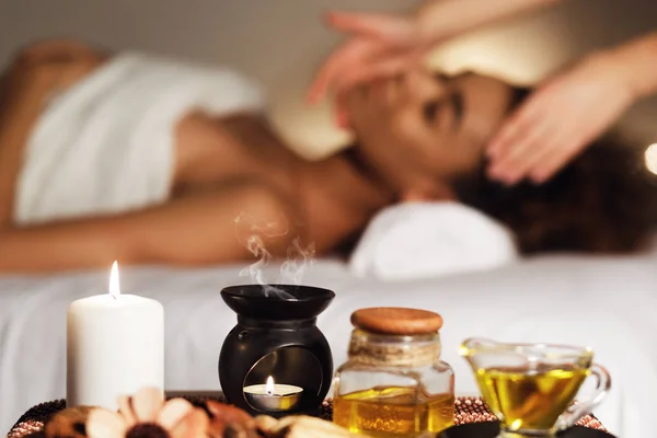 Aroma spa composition with candles and relaxing woman — Stock Photo, Image