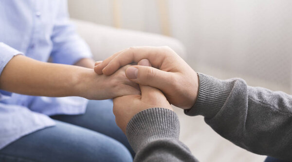 Psychologist consoling his patient, making supporting gesture
