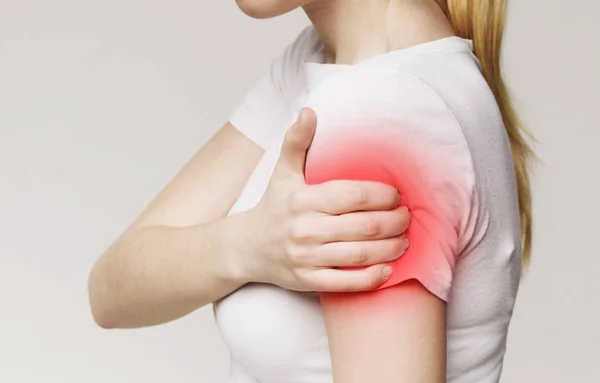 Woman with body-muscles problem, massaging her sore hand — Stock Photo, Image