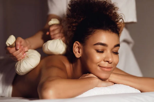 Body care. Spa body massage with hot herbal balls — Stock Photo, Image