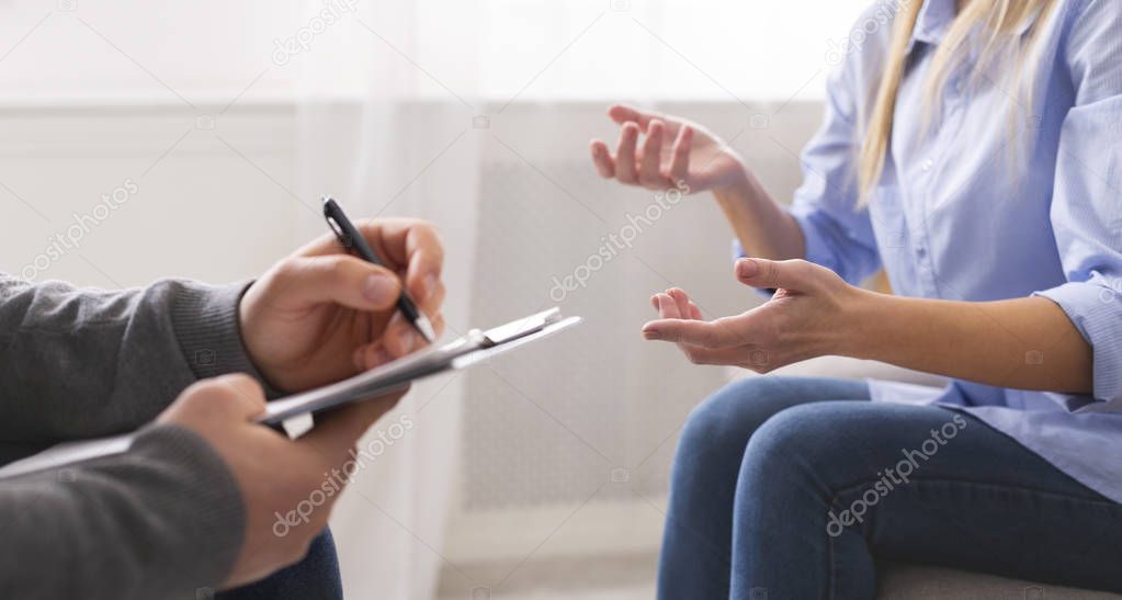 Emotional woman sharing her troubles and gesturing at psychotherapy