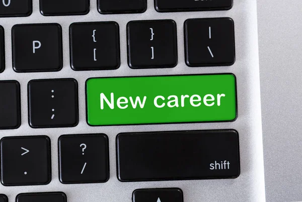 绿色键盘按钮上的新职业文本 — 图库照片
