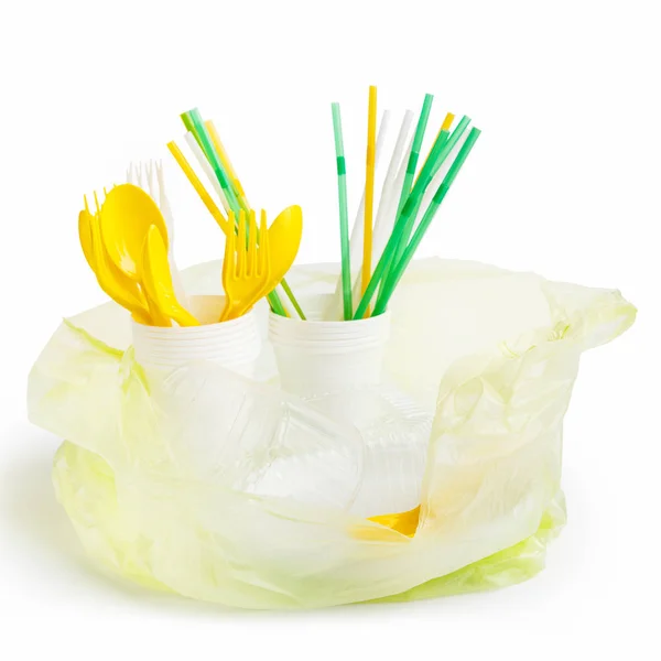 Bolsa de plástico llena de utensilios de plástico — Foto de Stock