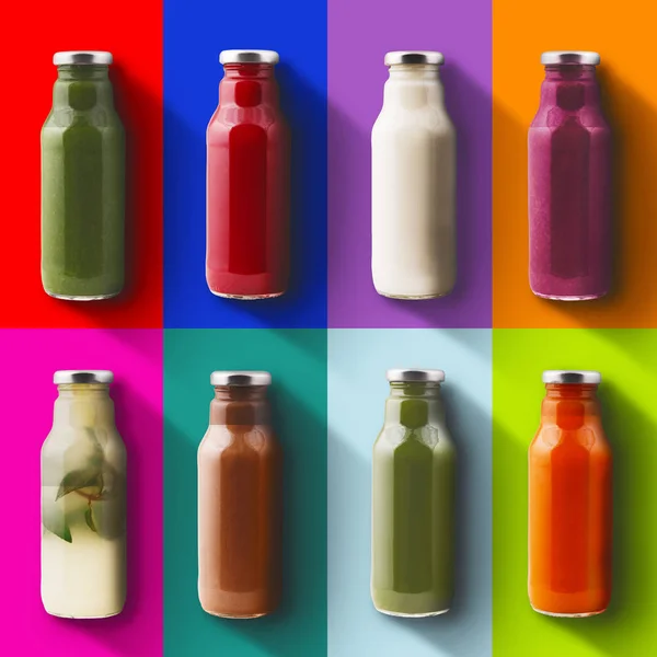 Flessen op gekleurde achtergronden — Stockfoto