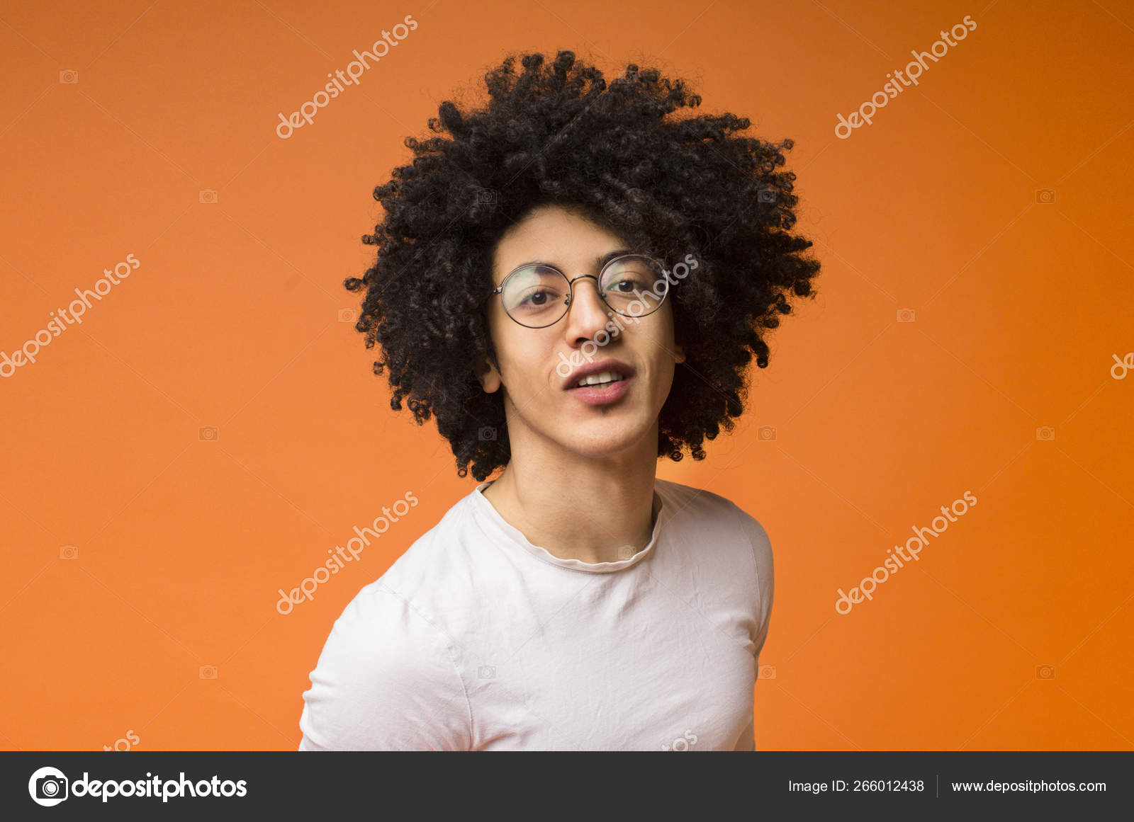 Friendly Black Bushy Guy On Orange Background Stock Photo