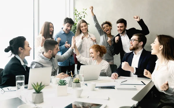 Business team celebrating success together on workplace — Stock Photo, Image