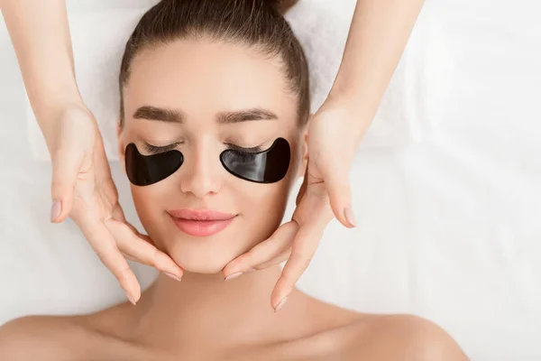 Face Massage. Woman With Black Eye Patches — Stock Photo, Image