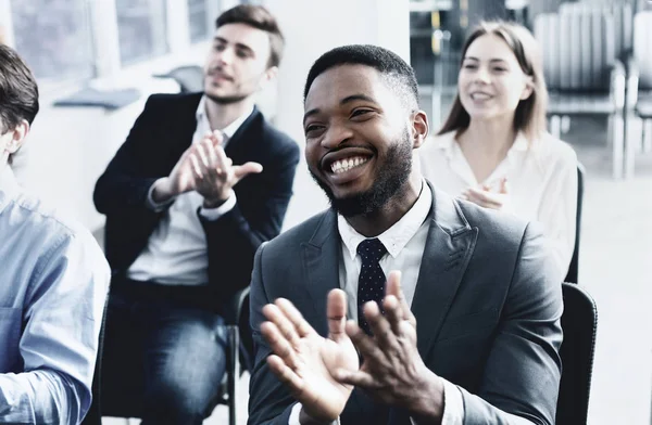Business training. African-american man applauding to speaker — Stock Photo, Image
