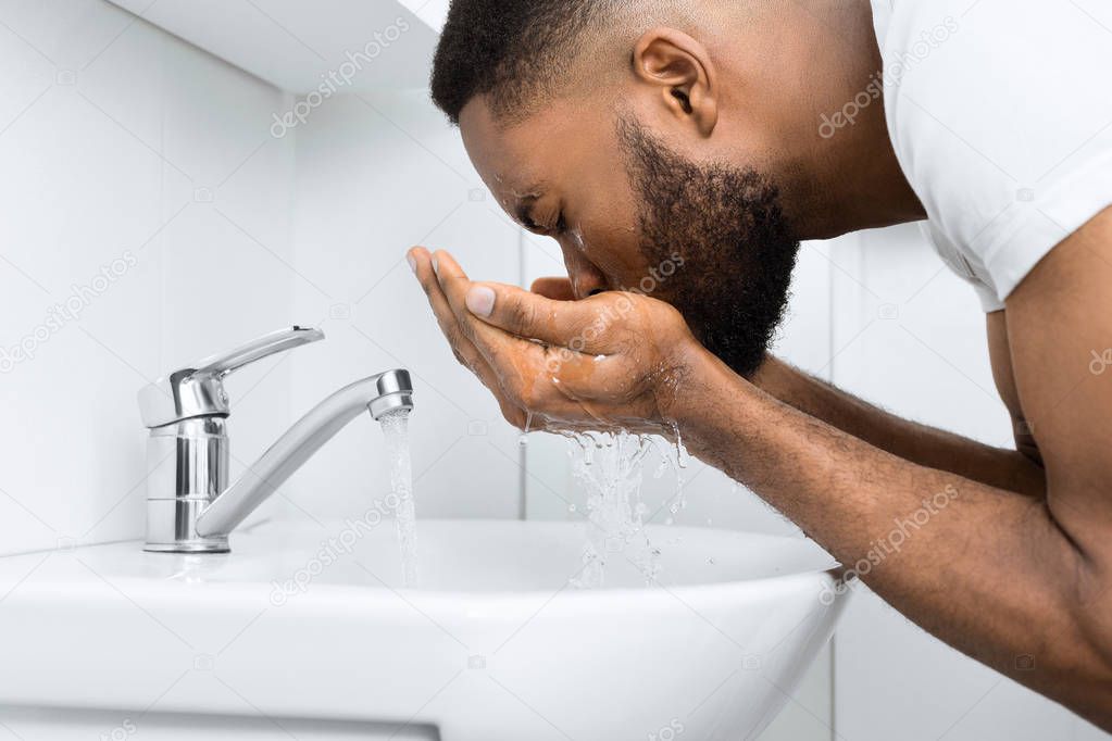 Afro man in bathroom.