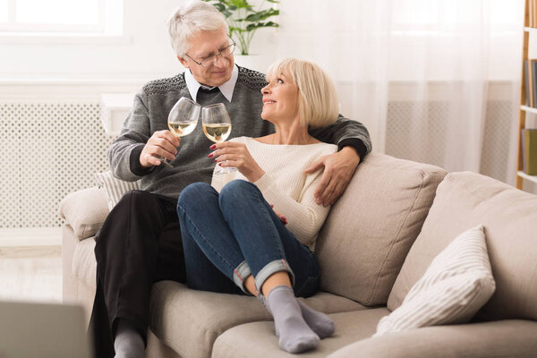 Mature Couple Drinking White Wine At Home