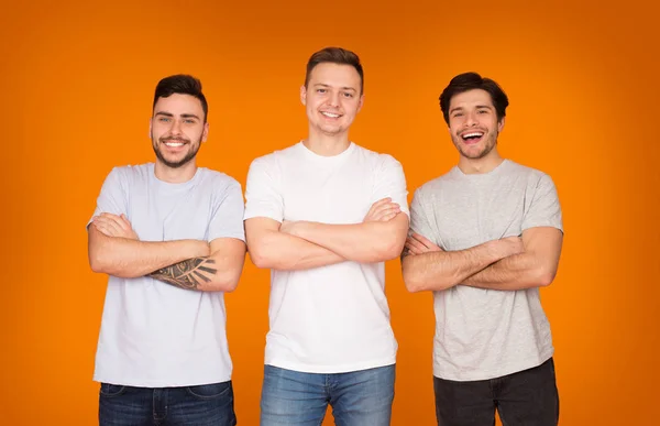 Handsome Men With Crossed Arms, Orange Background