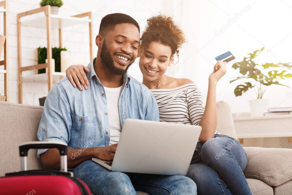 Happy Afro Couple Planning And Booking Hotel