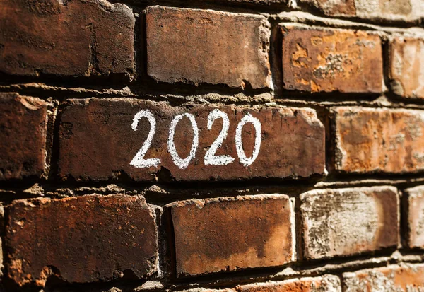 2020 new year concept written on the bricks wall — Stock Photo, Image