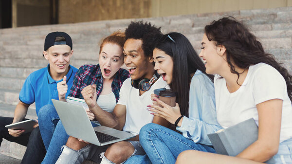 Emotional Teenage Students Looking Excited in Laptop