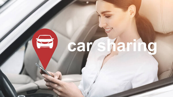 Business woman using car sharing mobile application