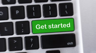 Computer keyboard with green GET STARTED button clipart