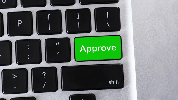 Word Approve on green button of laptop