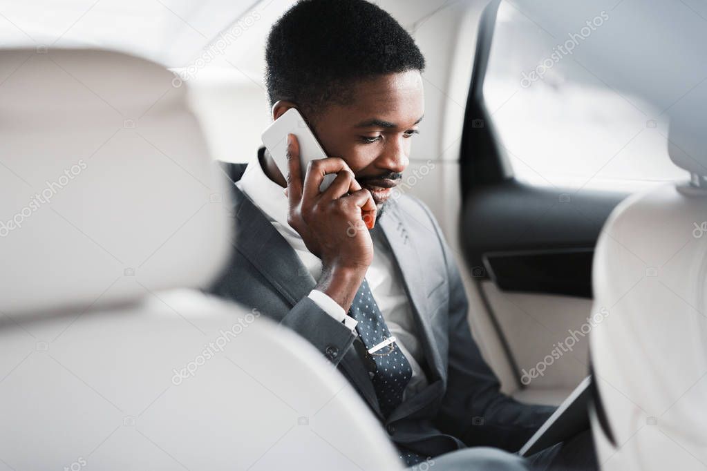 Business Trip. Man Talking On Phone And Discussing Work