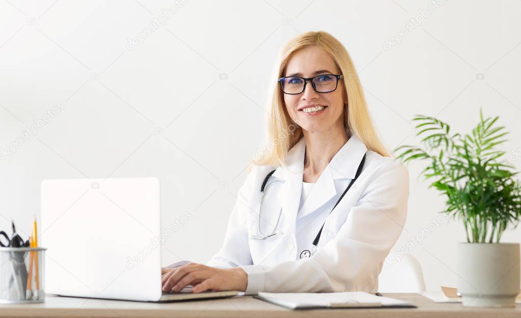Experienced Doctor Working On Medical Expertise In Office